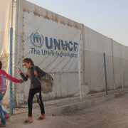 UNHCR  behind a fence